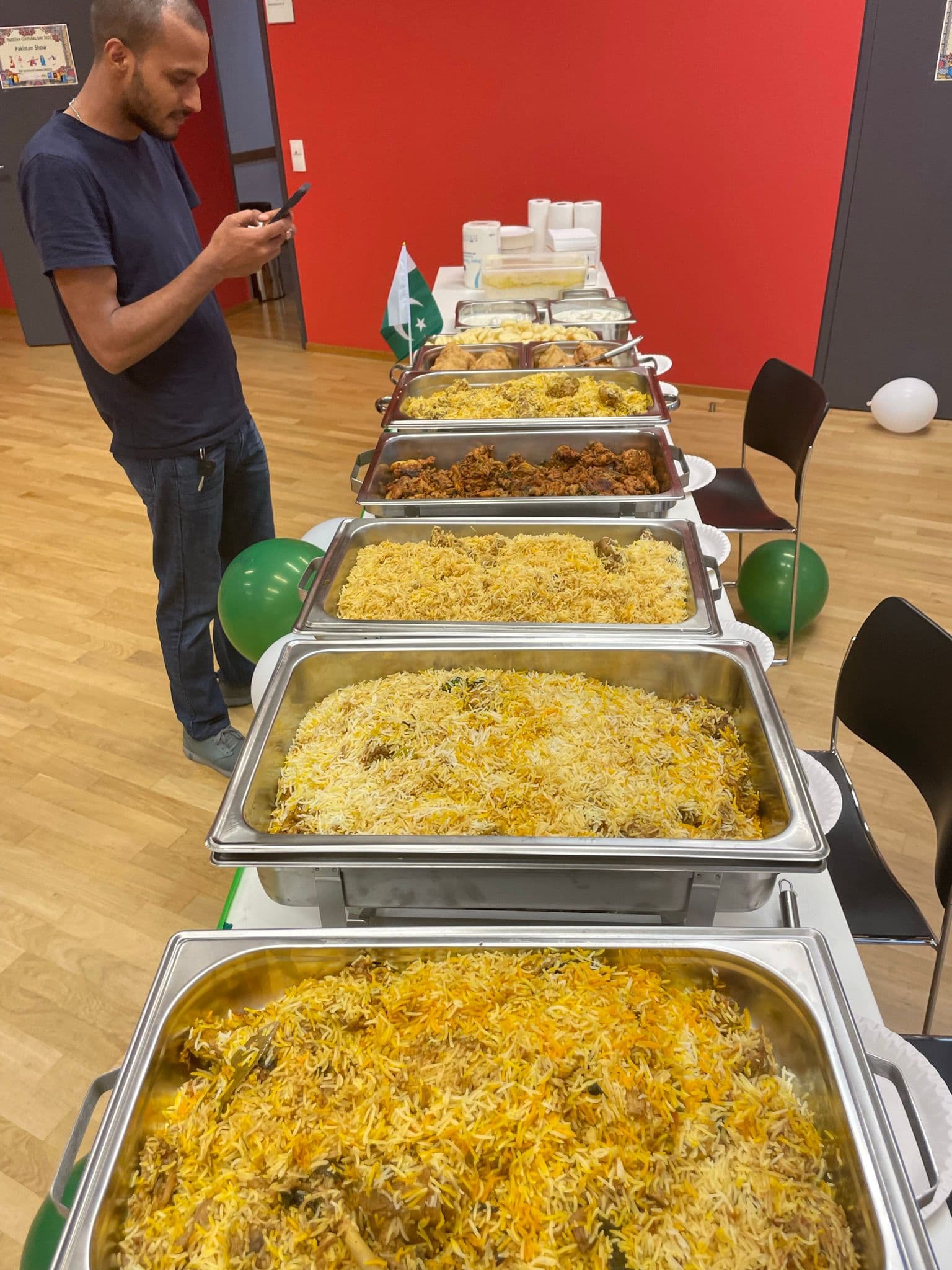 Large biryani buffet line at event
