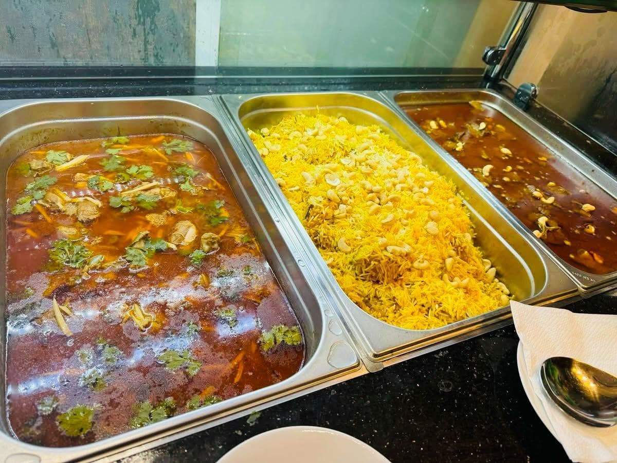 Buffet spread with curries and rice