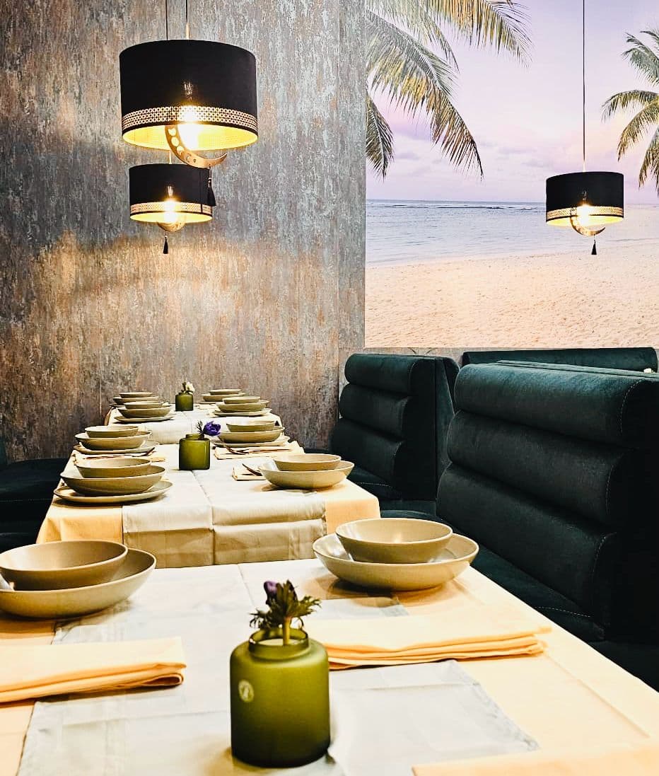 Elegant booth seating with gold pendant lamps